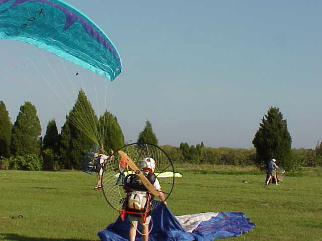 unknown pilot launching, Nick S in foreground